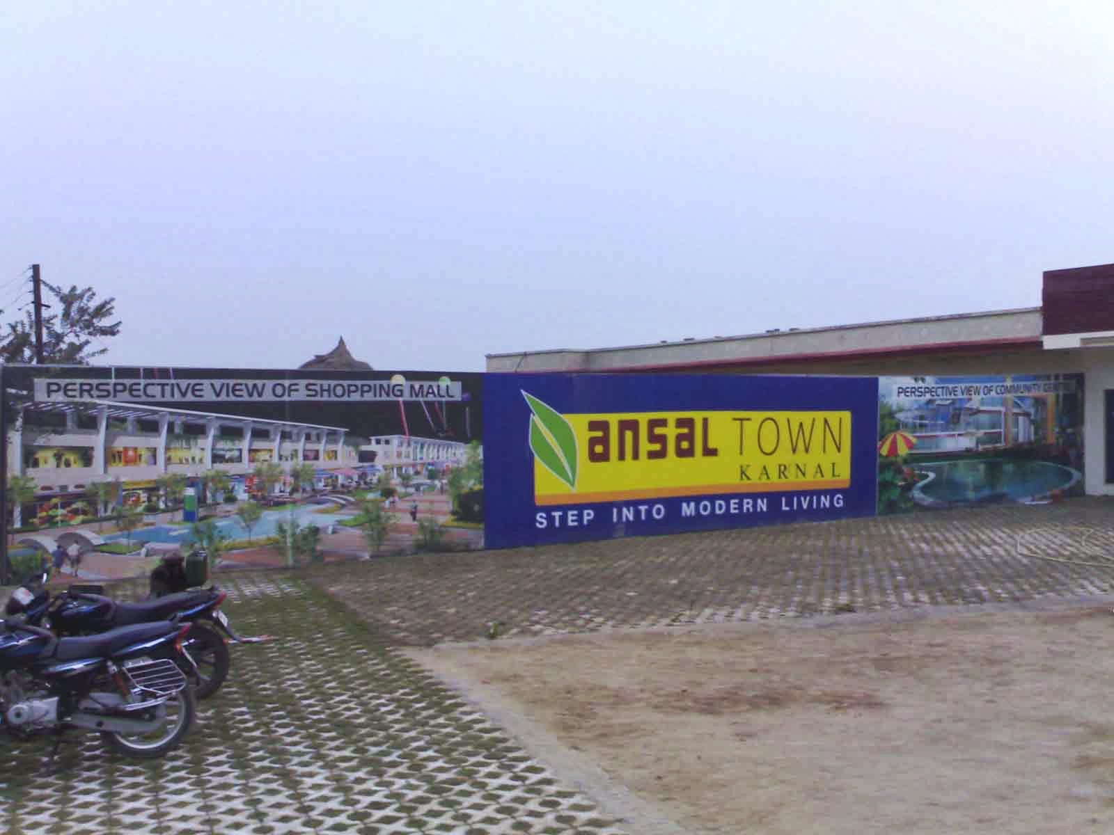 Ansal Town Karnal site wall branding with project perspective views