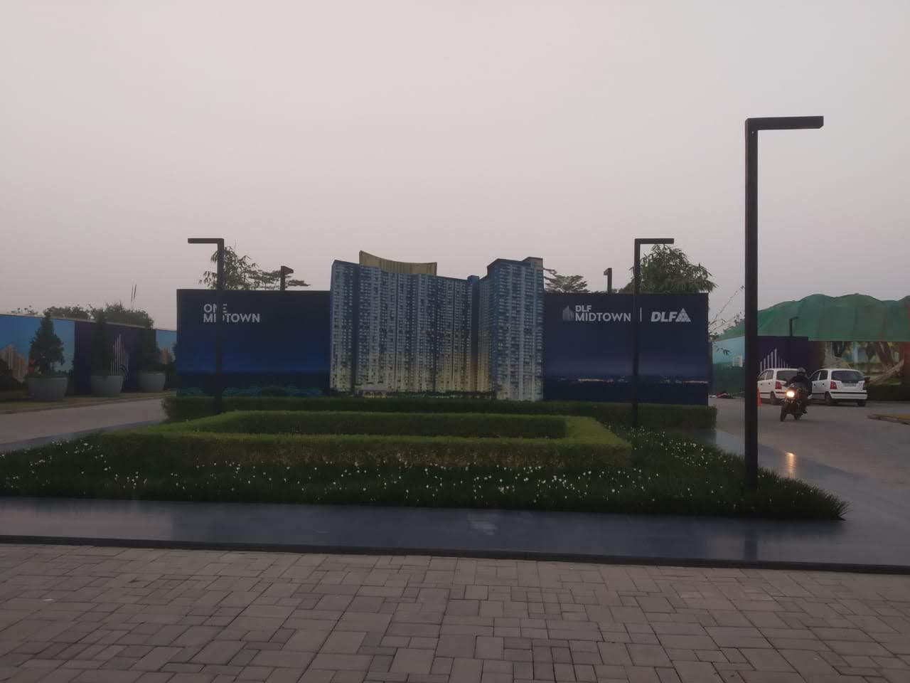 DLF One Midtown site entry hoarding with project visual