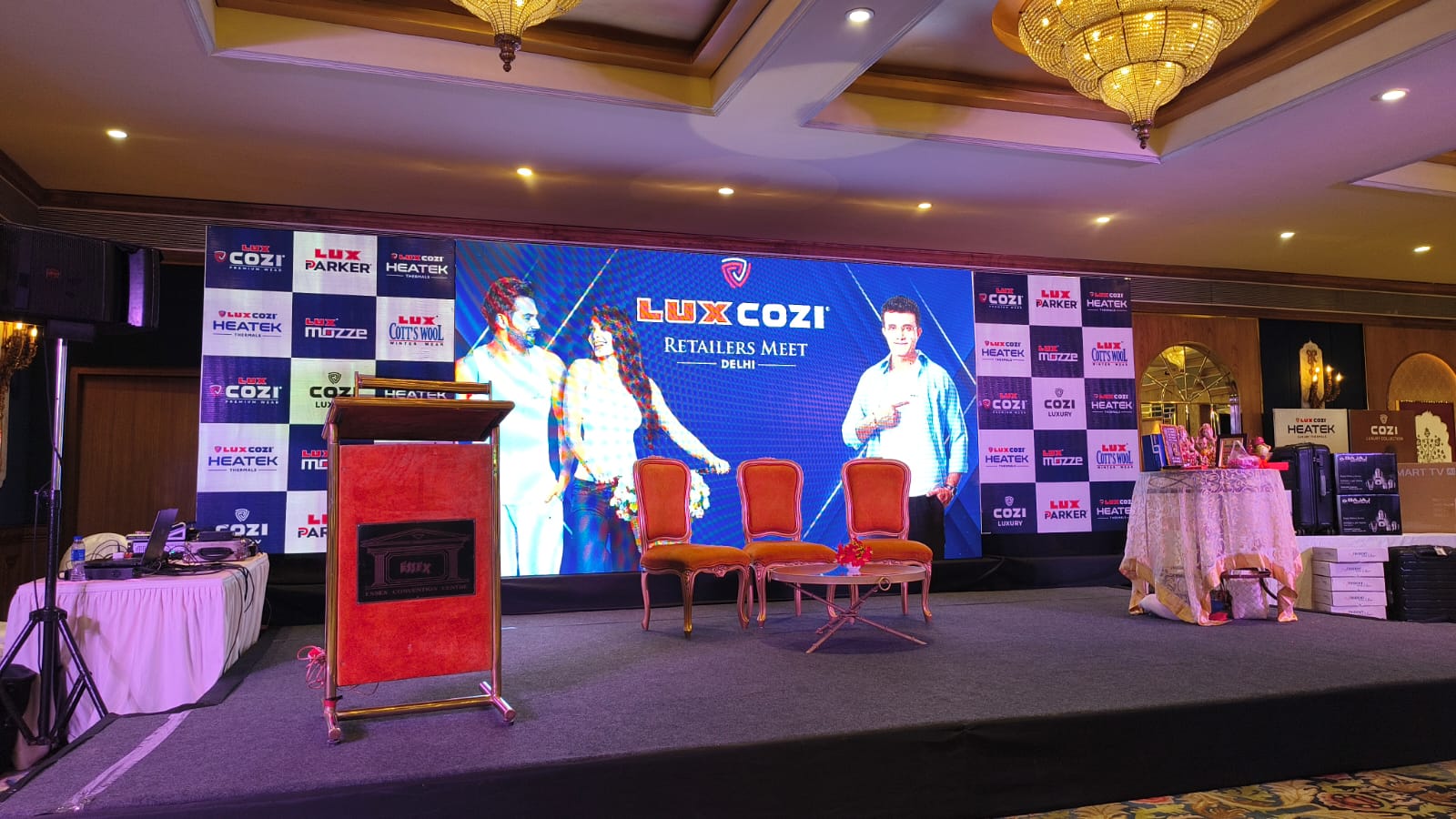 Lux Cozi main stage with LED screen and step-and-repeat backdrop