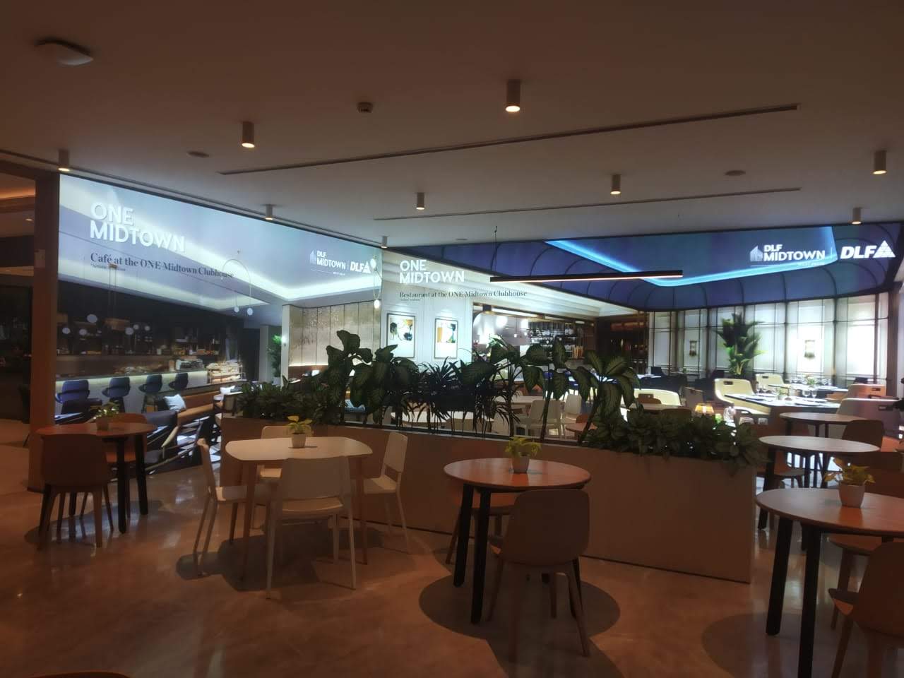 DLF One Midtown clubhouse cafe with illuminated fascia branding
